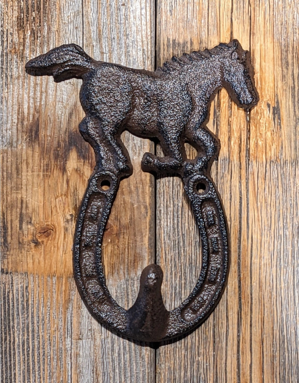 Horse with horseshoe hook